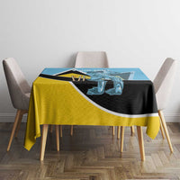 Blue and yellow cricket tablecloth with black stripe and player emblem, draped on table