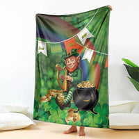 Green St. Patrick's Day throw blanket featuring leprechaun with harp, shamrocks, and pot of gold