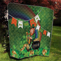 Green quilted shamrock blanket featuring leprechaun holding a harp and rainbow diagonal waves