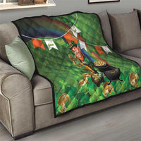Green quilt blanket on sofa, leprechaun with harp and black cauldron, rainbow flag trim
