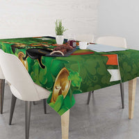 Green shamrock tablecloth featuring cauldron leprechaun and Irish harp