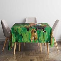 Green shamrock tablecloth with leprechaun, harp and pot graphic on dining table