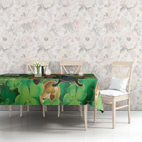 Green shamrock tablecloth with leprechaun and Irish harp design, full tabletop