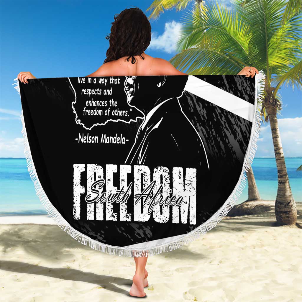 Black round beach blanket with Mandela portrait and Freedom South Africa text, white fringe edge