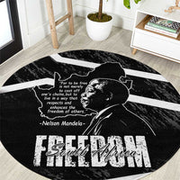 Black round area rug with Nelson Mandela portrait, map outline, and Free South Africa text
