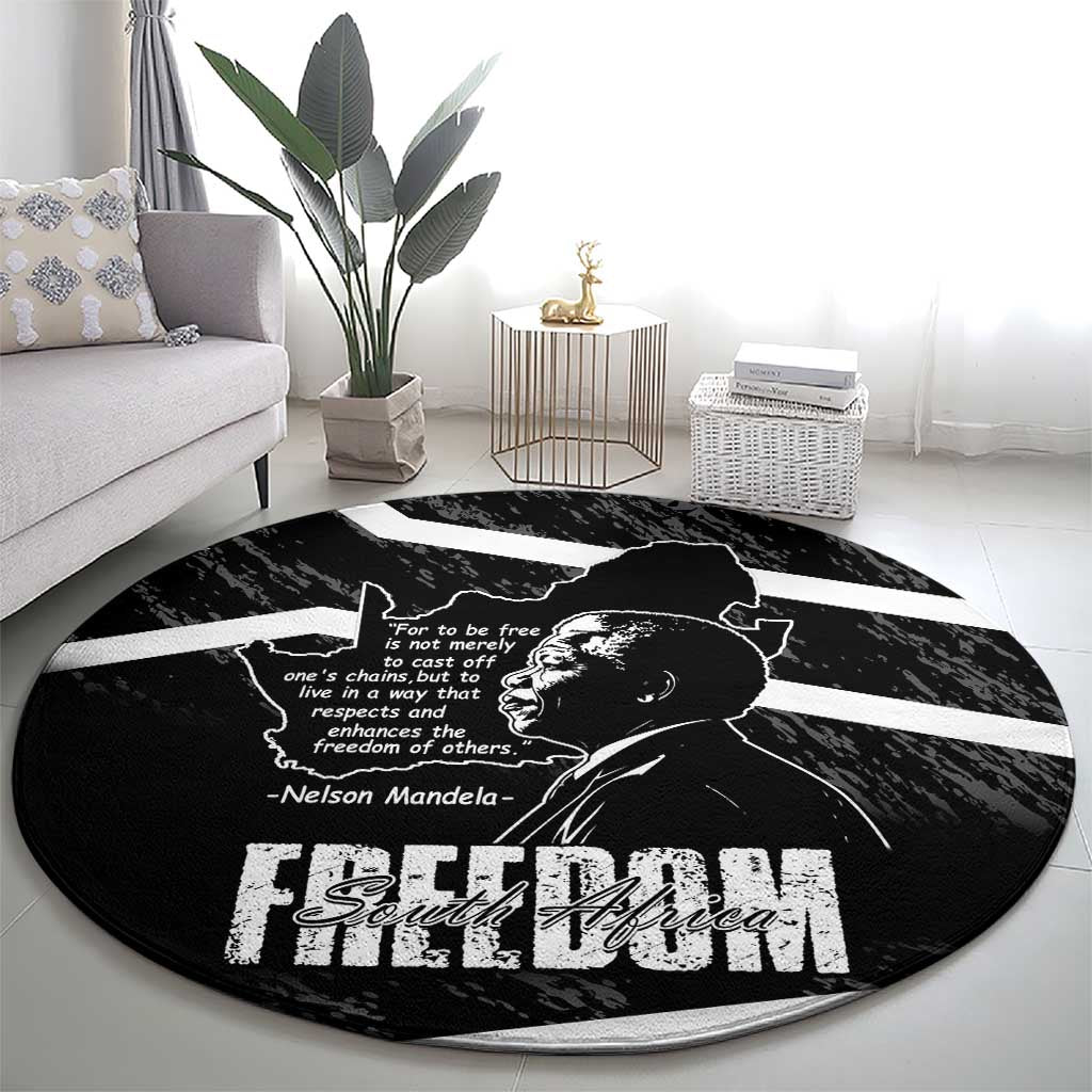 Black round area rug with Mandela portrait and Free South Africa graphic lettering