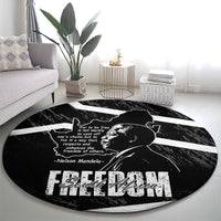 Black round area rug with Mandela portrait and Free South Africa graphic lettering