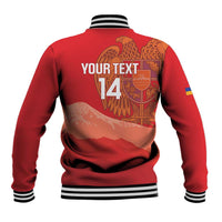 Red back of varsity jacket with striped rib hem, number 14, and wings crest graphic