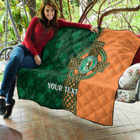 Custom cricket quilt laid out outdoors, green/orange sides with Celtic cross shamrock emblem