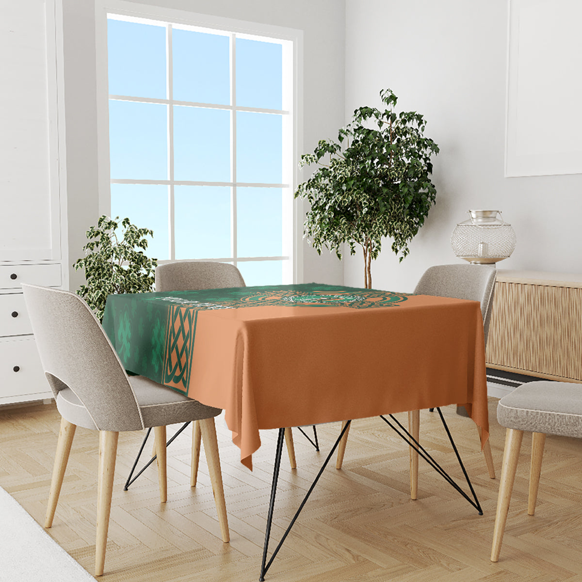 Custom cricket tablecloth with green Celtic panel and orange cloth on dining table.