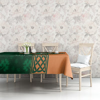 Custom cricket tablecloth with green and orange Celtic crest design on tabletop.
