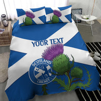 Blue and white Scotland cricket bedding set with custom text, thistle flowers, and logo