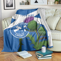 Blue and white Scotland cricket blanket draped with thistle artwork and 'YOUR TEXT'