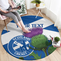 Round blue-and-white Scotland cricket rug with thistle graphic and custom text strip