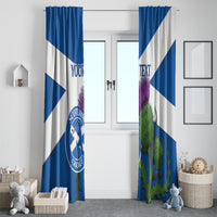 Blue and white curtains framing a doorway with Scotland Cricket emblem and thistle art