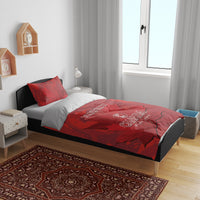 Red Canada bedding set on bed with duvet and 2 pillowcases, maple leaf themed graphics