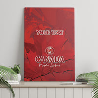 Unframed red canvas wall art with Canada emblem, maple leaves, and custom text