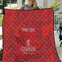 Red quilt blanket with custom text and Canada emblem, quilted diamond pattern