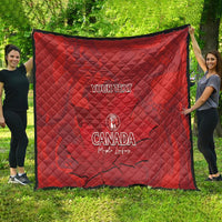 Red quilt blanket with custom text and Canada logo, diamond quilting, hanging display