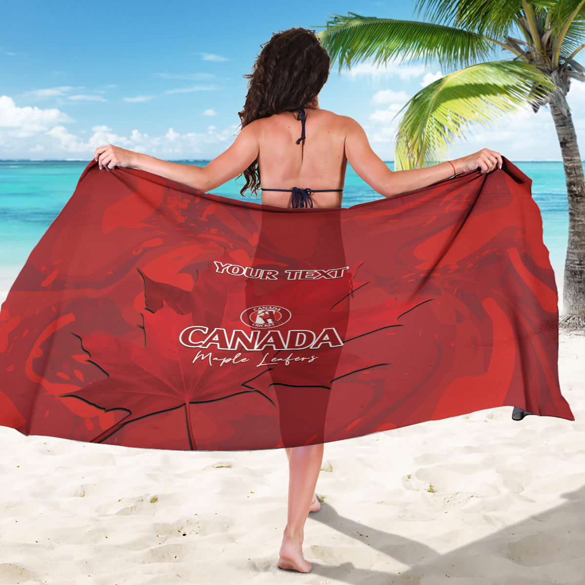 Red custom cricket sarong with 'Your Text' and Canada maple leaf logo, spread.