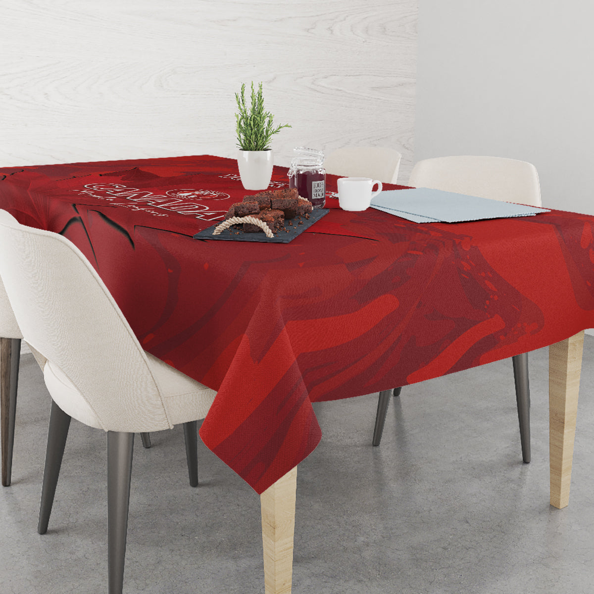 Red Canada tablecloth with draped corners and maple leaf design