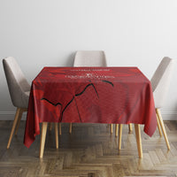 Red tablecloth with Canada emblem and maple leaf print on dining table