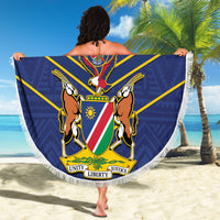 Blue round beach blanket with white fringe featuring Namibia Cricket crest