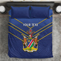 Blue duvet cover and two pillowcases with cricket emblem, yellow V stripes, “YOUR TEXT”
