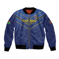 Blue cricket bomber jacket, front zip, Namibia Go Eagles crest, gold diagonal stripes