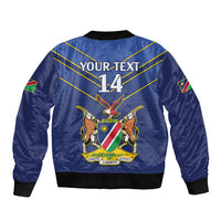 Blue cricket bomber jacket, back graphic with YOUR TEXT 14, eagle emblem, gold diagonal lines