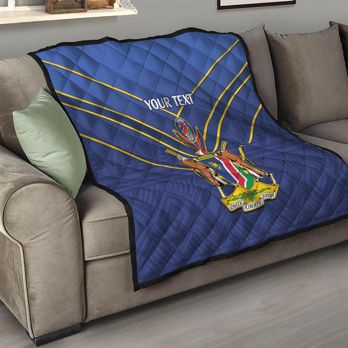 Blue quilt with diamond quilting, yellow diagonal stripes, crest emblem and “YOUR TEXT”