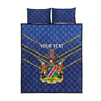 Blue quilt bed set with two pillowcases, large Namibia crest, yellow stripe borders