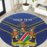 Blue round cricket rug with Namibia crest and lions, yellow border and “YOUR TEXT”.