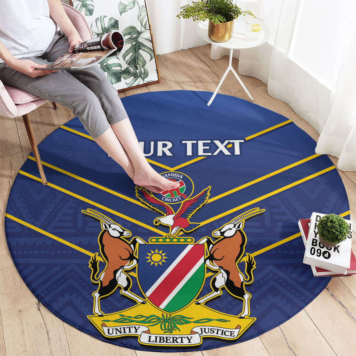 Blue round cricket rug with Namibia emblem, lions and flag shield, “YOUR TEXT” banner.