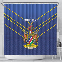 Blue cricket shower curtain with Namibia crest, gold diagonal stripes, and “YOUR TEXT” in white.