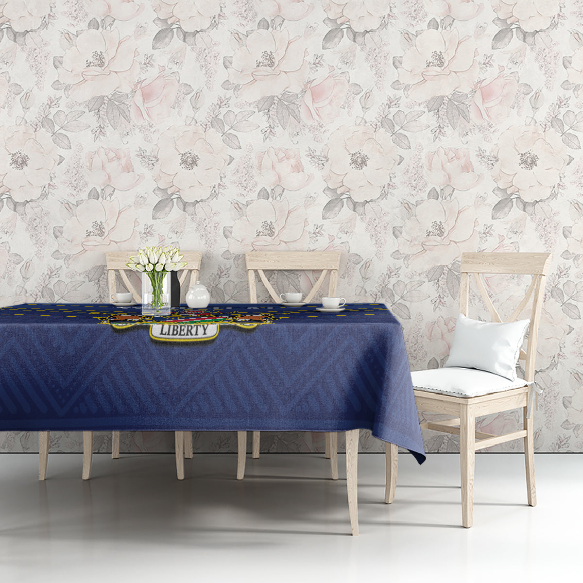 Blue tablecloth with yellow stripes and crest emblem on dining table