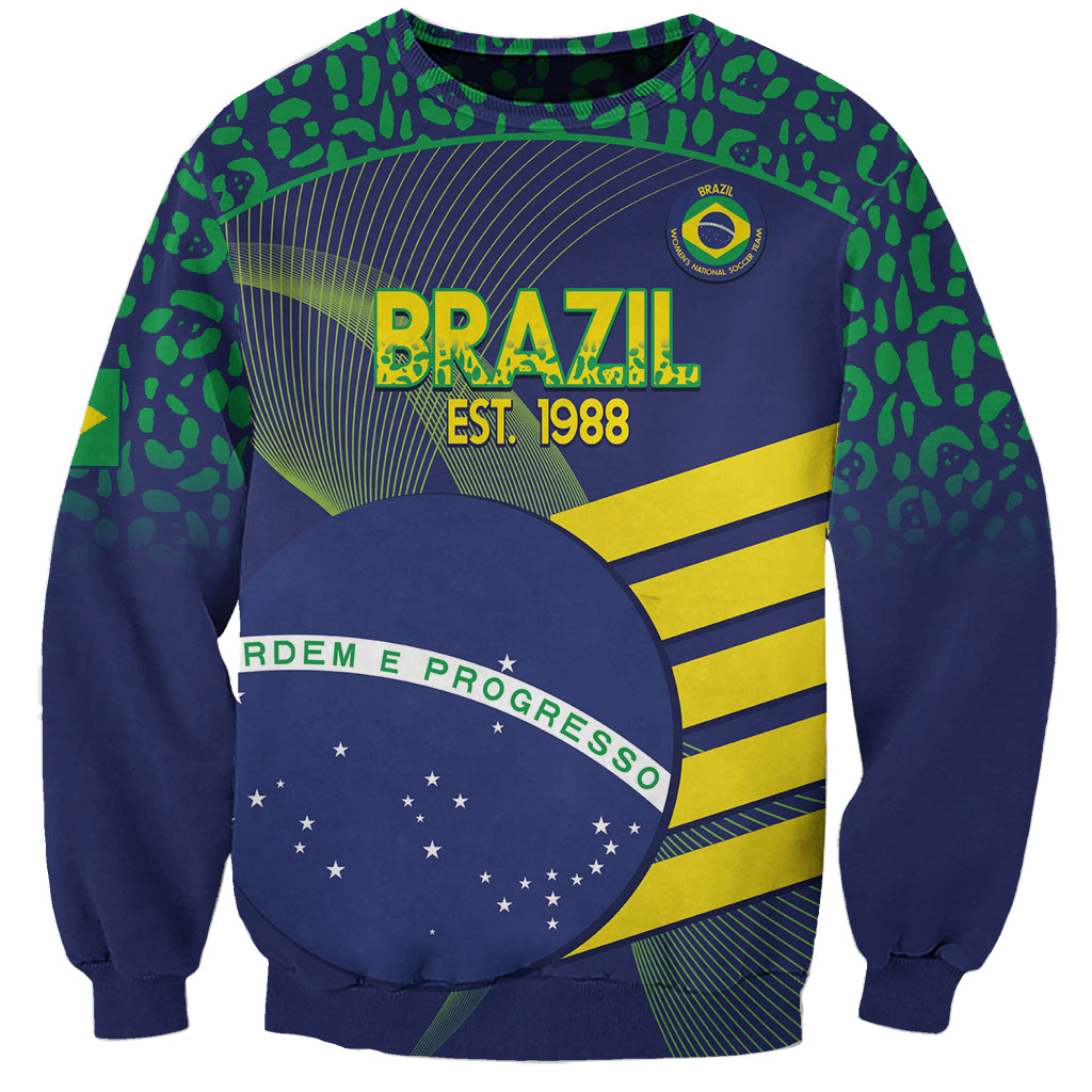 Unisex Brazil football sweatshirt with blue graphic 'BRAZIL EST. 1988' and green patterned sleeves.
