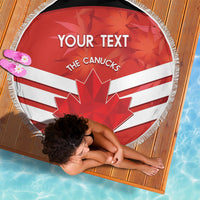 Round beach blanket held by person, red-white Canadian flag with maple leaf and fringe