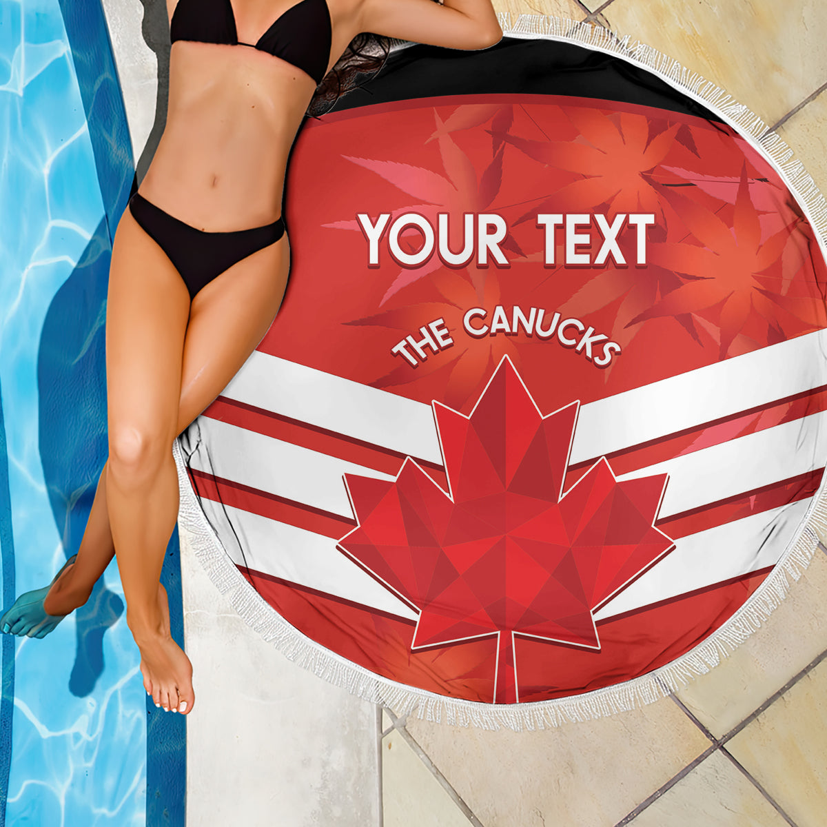 Round beach blanket draped by pool, red-white Canadian flag with maple leaf and fringe edge