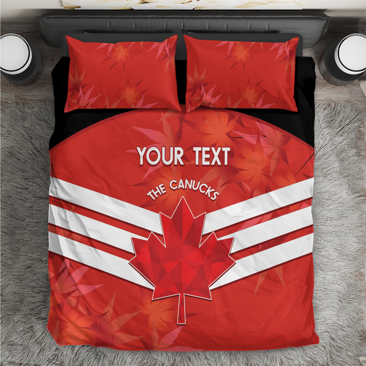 Red bedding set viewed from above, duvet with maple leaf and white stripes, two red pillows