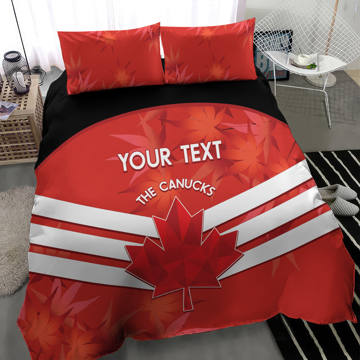 Red bedding set with duvet featuring maple leaf and white stripes, two red pillows on dark base