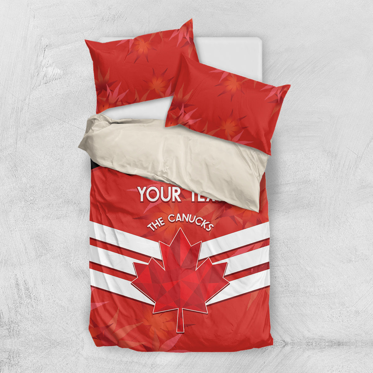 Red duvet and pillow bedding set with maple leaf graphic and white striped band