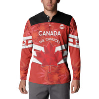 Red/black button-front Canada soccer sweatshirt on model with CANADA the CANUCKS logo