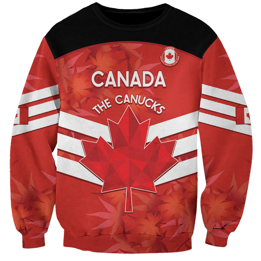 Unisex red and black Canada soccer sweatshirt with Canada wordmark and maple leaf