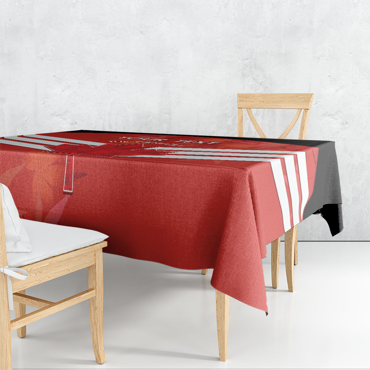 Red tablecloth draped over rectangular table with matching white diagonal stripe accents.