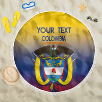 Round yellow and blue beach blanket with white fringe, Colombia crest graphic and text