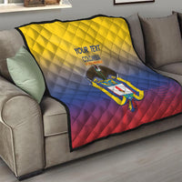 Yellow, blue, and red quilt draped on a couch with Colombia crest and “YOUR TEXT”.