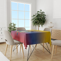 Red, blue and yellow football-themed tablecloth on dining table with graphic