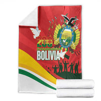 Folded red Bolivia-themed blanket with 200 years Bolivia text, dove, coat of arms, flag stripes