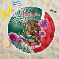 Round beach blanket with green and red Aztec eagle graphic and white fringe border
